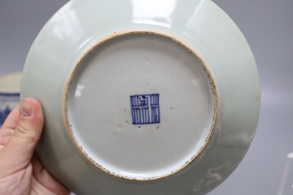 Five pieces of Chinese ceramics including two blue and white plates, a Canton plate, a blue and white mug and a prunus jar and cover,